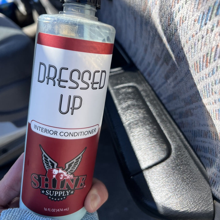 Shine Supply Dressed Up interior conditioner held inside a vehicle