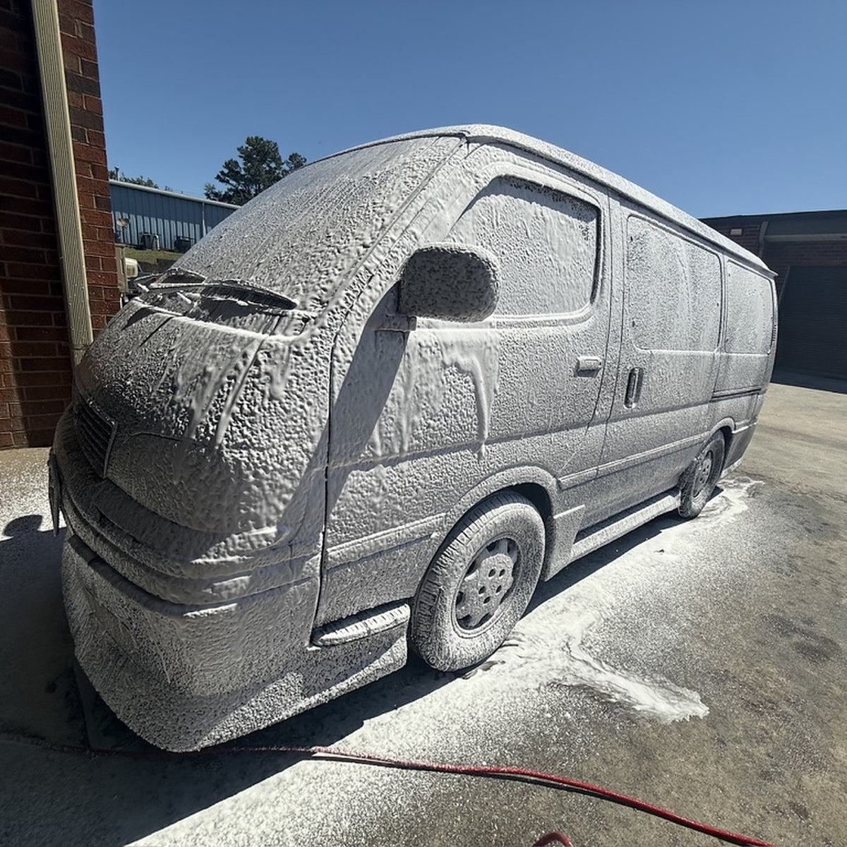 Shine Supply Hot Shot foam soap covering a van in thick foam
